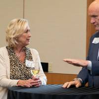 people talking at event